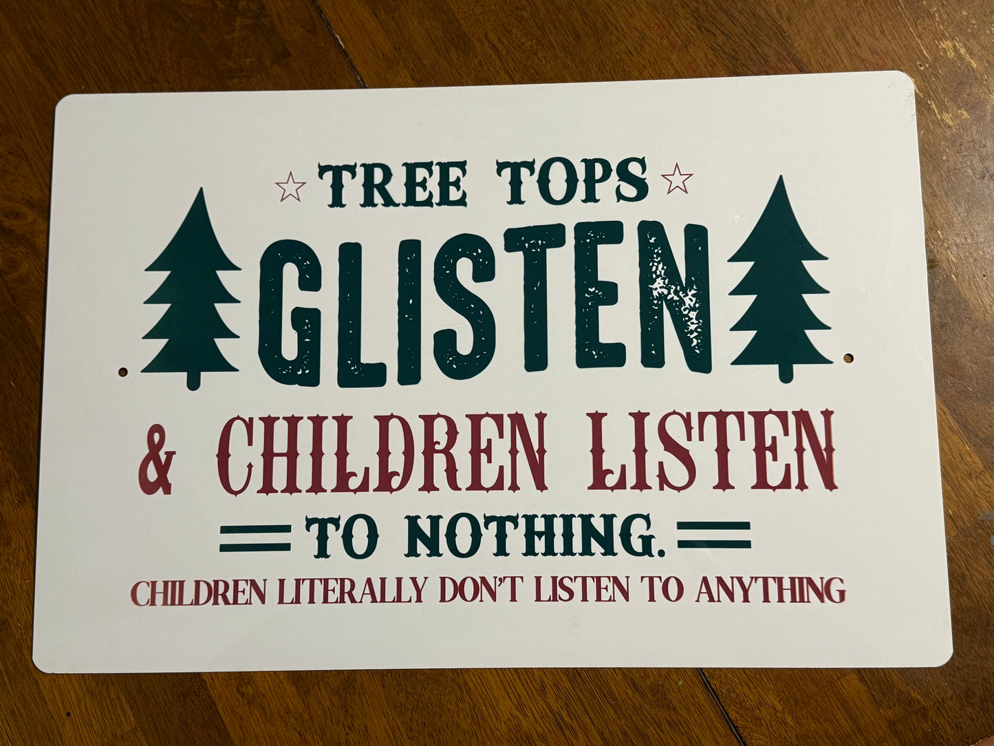 Tree Tops Glisten sign